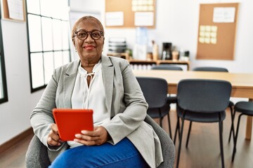 Sticker - Senior african american woman business worker using touchpad at office