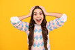 © Olena - Excited face. Amazed child with open mouth on yellow background, surprise.