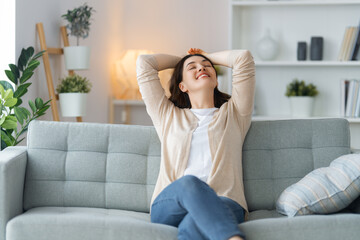 Wall Mural - woman resting on a sofa