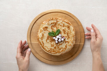 Wall Mural - Big pancakes on the table, cooking delicious homemade pancakes