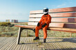 © ADDICTIVE STOCK - Spaceman sitting on giant bench