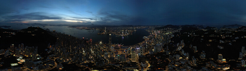 Victoria Harbour in drone point of view at night in panoramic mood