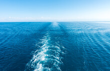 Footprint On The Water From The Ship. White Wave On Blue Water. Blue Sea Water. Water And Sky.