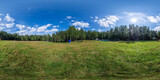Fototapeta  - Full seamless 360 degree HDRI spherical panorama on a large spacious green field, sunny weather in the forest, glade in the forest. VR content