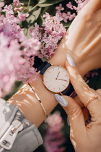 Classic Beautiful White Watch On Woman Hand. Close-up Photo.