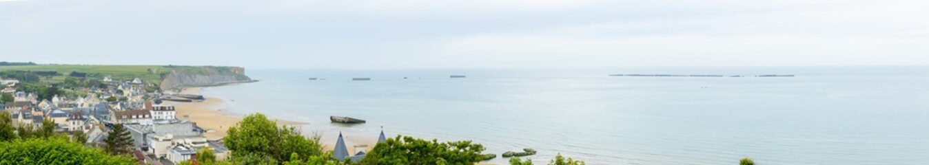 France, normandy landscapes, Beautiful Normandy's coastline on a cloudy day. With the remnants of the mulberry port.