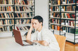 © Mariia Korneeva - Mature Female Student Working On Laptop In College Library.