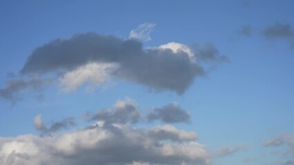Wall Mural - 4k scenic video time-lapse of beautiful sunny sunset cloudy cloudscape. white and grey fluffy clouds