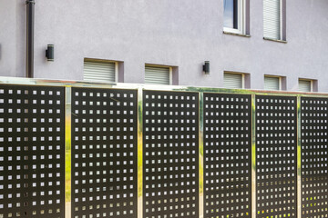 Wall Mural - Perforated Metal Fence. Metal sheet panel fence
