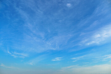 Wall Mural - bright blue sky with clouds as abstract background