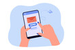 Hand holding smartphone with envelope and send button on screen. Person sending letter via mobile app flat vector illustration. Technology, internet, communication concept for banner or landing page
