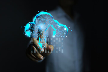 The programmer in white reaches out to touch a low poly cloud to download data in a binary form stored in the cloud technology to secure it from cyber attack. information technology concept.