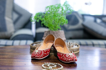 Indian Punjabi bride's red wedding shoes close up