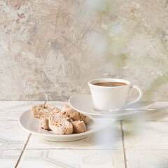 Wall Mural - a cup of coffee and cookies on a light table