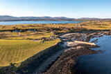 Fototapeta  - Aerial view of the amazing rocky coast at Ballyederland and pier by Dunkineely in County Donegal - Ireland