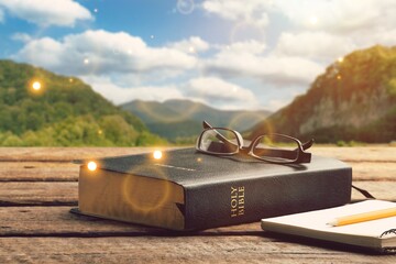Wall Mural - double exposition with holy bible with sunset