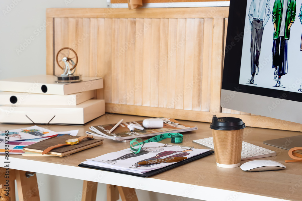 Workplace of clothes stylist in modern studio