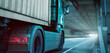 © photoschmidt - Truck with a container driving through a tunnel