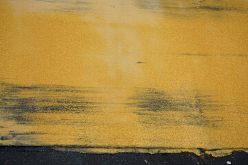 There is a flaw in the road marking paint. from the heat of asphalt