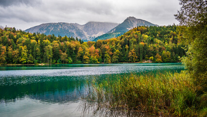 Canvas Print - Alatsee in the Allgäu with rain clouds and lake