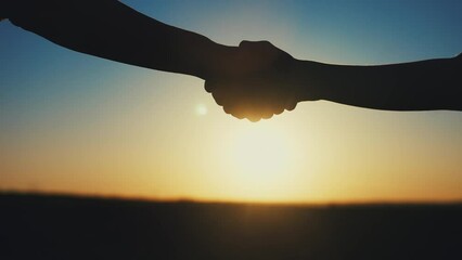 Sticker - handshake farmers silhouette. agriculture business concept. close-up farmers hands silhouette shaking hands silhouette making a contract agreement. farmers negotiations in sun agriculture business