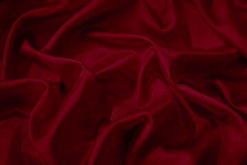 Wall Mural - Black red silk satin. Wavy folds. Shiny smooth fabric. Beautiful background with space for design.