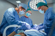 © Rido - Team of surgeons performing operation at hospital