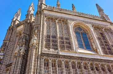 Wall Mural - Principal facade of the San Juan de los Reyes monastery. View from Plaza San Juan de los Reyes square. Toledo, Castilla La Mancha, Spain.