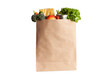 © Candle photo - Paper shopping bag with various grocery items on white background, isolated. Bag of food with fresh vegetables, fruits, pasta and canned goods. Food delivery, shopping or donation concept.