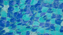 Water Wave Over The Blue Tile In Swimming Pool