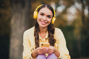 Sticker - Portrait of beautiful trendy cheery girl listening song single melody pop hit different bass pastime outdoors