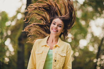 Sticker - Portrait of attractive funky cheerful girl throwing hair having fun enjoying spending time vacation sunlight outdoors