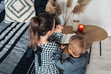 Children pray and read the Bible together, christian concept