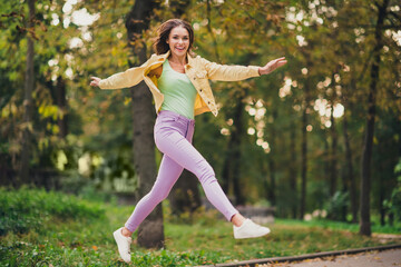 Sticker - Full length body size view of attractive funky cheerful girl jumping having fun enjoying spending time outdoors