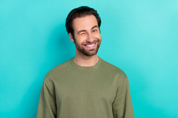 photo of coquette brunet young guy blink wear green pullover isolated on teal color background