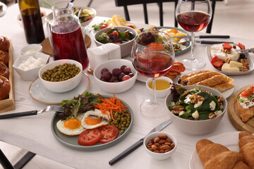 Many different dishes served on buffet table for brunch