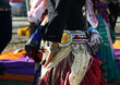 Elements of clothing for a gypsy dance, a scarf at the waist, a belt with a monist, hands with bracelets, a dancing woman