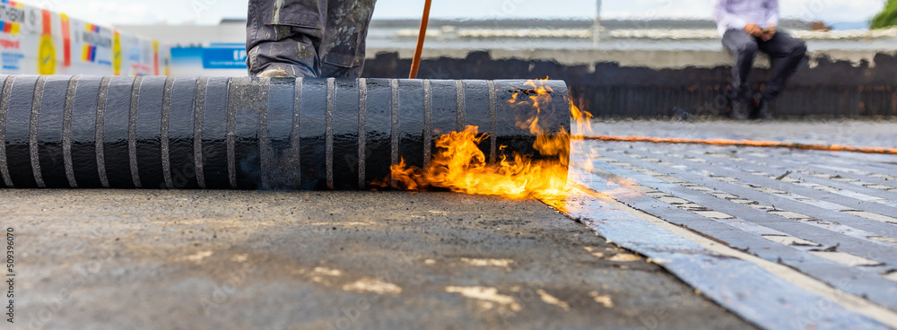 Bituminous membrane waterproofing system details and installation on flat rooftop.