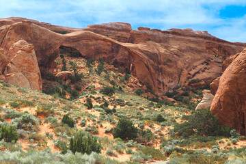 Wall Mural - Landscape Arch, the longest of arches in Arches National Park, Utah, USA. Devil's Garden trail. Hiking in the American southwest. Geological formations in Utah desert. Sandstone cliffs and bridges.