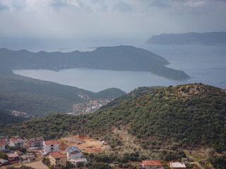 Harbour of city Kas or Kash in Turkey and Greek island Kastelorizo. Charming view of seaside resort town. Romantic harbour with yacht marina and mosque with minarets