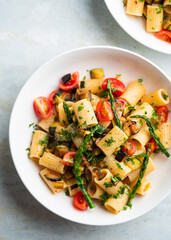 Wall Mural - Pasta salad with grilled vegetables, zucchini, eggplant, asparagus and tomatoes.