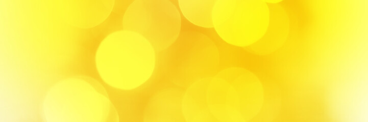 Wall Mural - Bright yellow sparkling glitter bokeh background, banner texture. Abstract defocused lights header. Wide screen wallpaper. Panoramic web banner with copy space for design