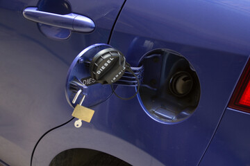 Wall Mural - Image of an open tank of a car with a lock. Reference to expensive fuel and the increase in gasoline thefts