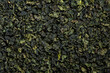 Chinese green leaf oolong tea. Dried tea leaves background, top