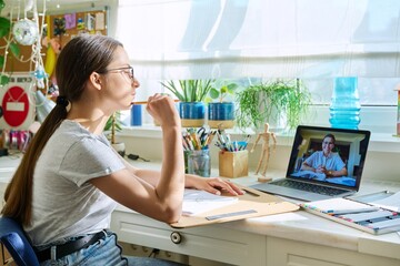 Online drawing lesson, teenage girl having video conference with teacher