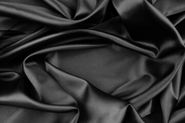 Wall Mural - Closeup of rippled black silk fabric