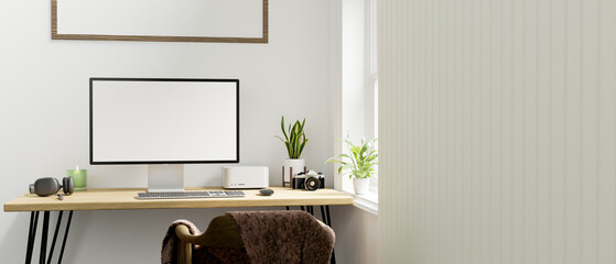 Comfortable bright home workplace with computer mockup on wood table, wood armchairs