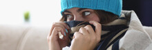 Young Woman Hide Nose In Scarf Feeling Cold Because Of High Temperature