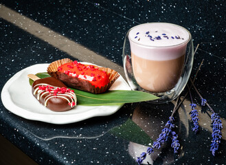 Wall Mural - Pink lavender latte coffee with eclairs