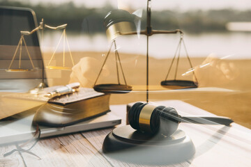 Business and lawyers discussing contract papers with brass scale on desk in office. Law, legal services, advice, justice and law concept picture with film grain effect